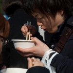 Anti-nuclear protesters stop to enjoy soba, a popular noodle soup, in Hibiya Park downtown Tokyo, Japan, on March 11, 2012.